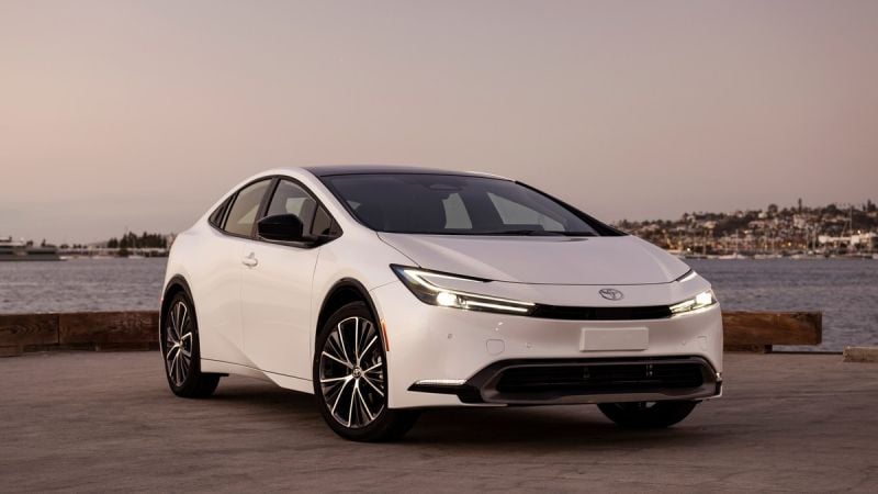 Front three-quarter view of 2026 Toyota Prius Limited showing LED headlights, grille, and hybrid design