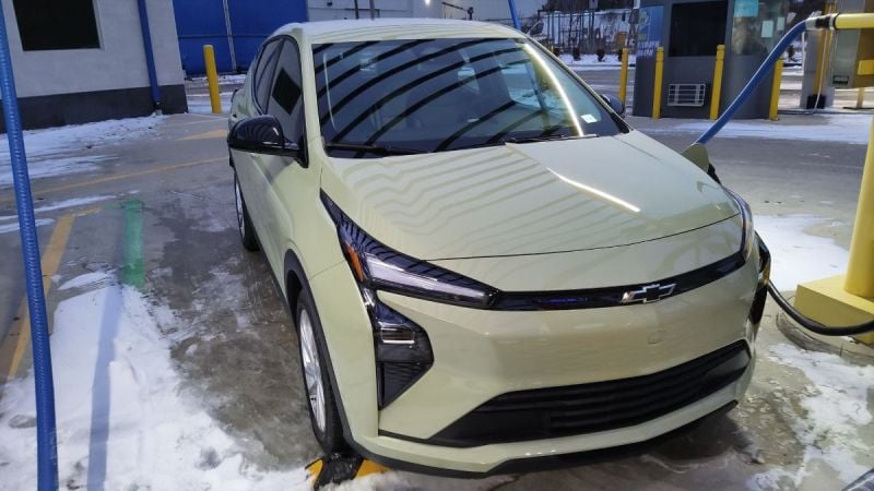 A 2027 Chevrolet Bolt looks great in a preproduction form charging in public