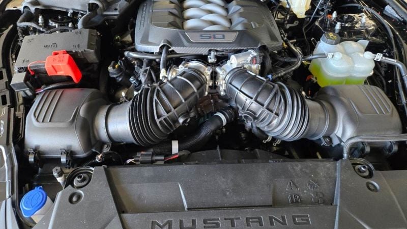 The engine area of a Ford Mustang GT shows off dual intakes