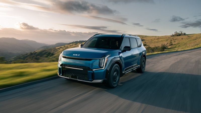 Blue Kia EV9 Driving