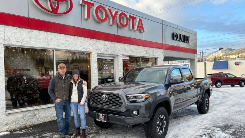 Bret and Mindee Joachim in front of their 3rd gen Toyota Tacoma truck at the Colville, WA Toyota Dealership