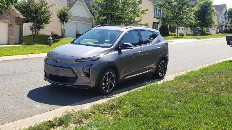 Gray Chevy Bolt parked on a residential street