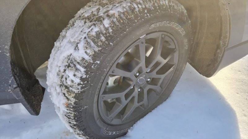 A Yokohama Geolandar tire is shown conquering snow