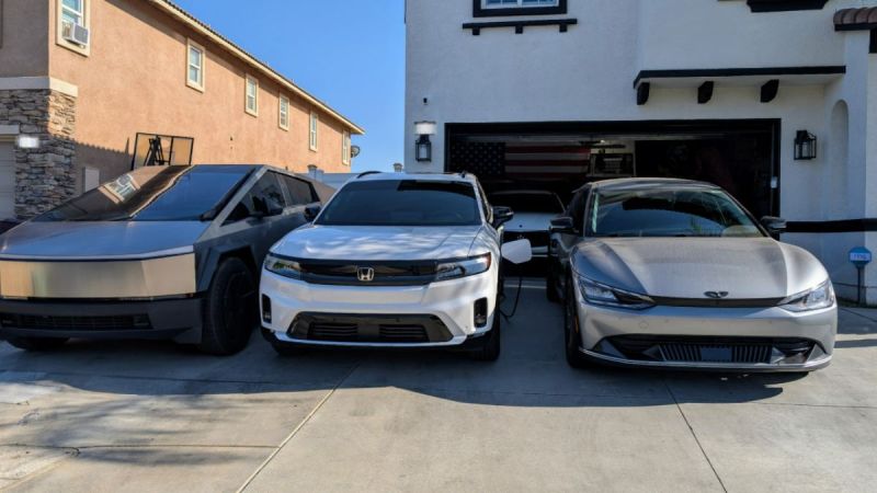 Three electric cars parked on a driveway: a Tesla Cybertruck is on the left, a white Honda Prologue in the middle, and a sleek gray Genesis on the right. A modern house and open garage are in the background.