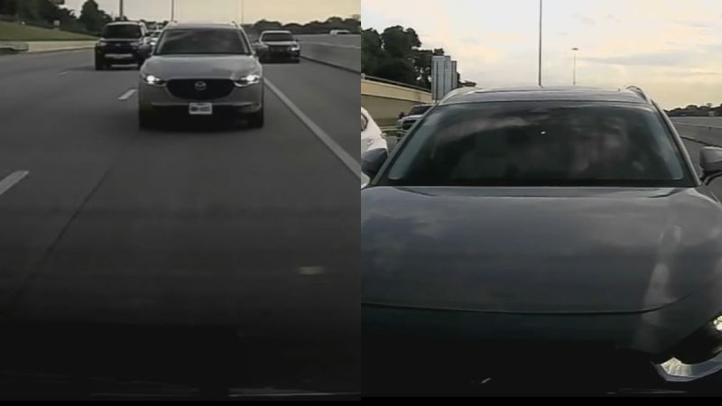Gray Mazda SUV driving on multi-lane highway during overcast day, viewed from behind and side angles