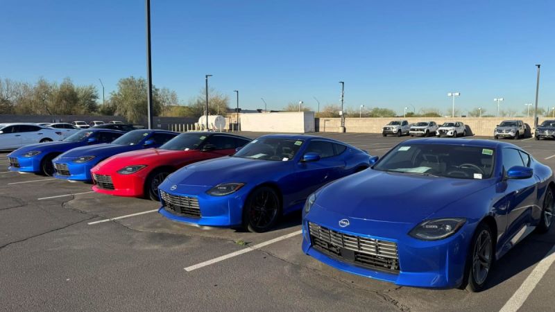 a group of Nissan Zs parked next ot each other 