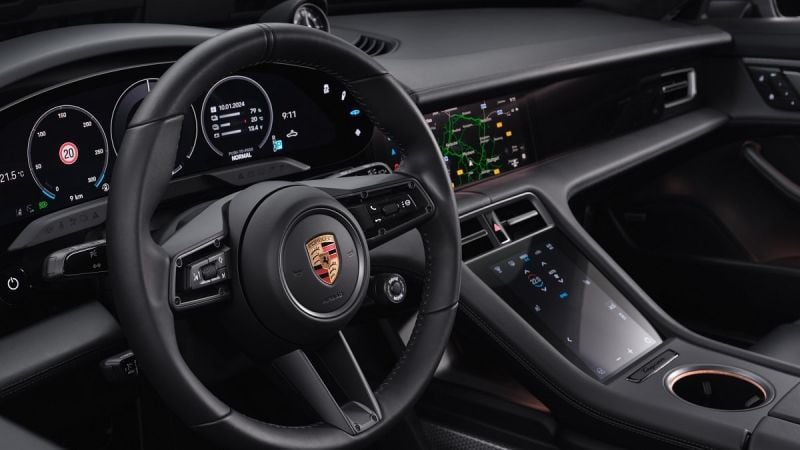 Interior of a Porsche Cayenne showing dashboard with touch screens
