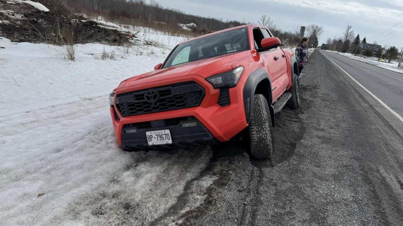 Red Toyota Tundra Stuck on Road