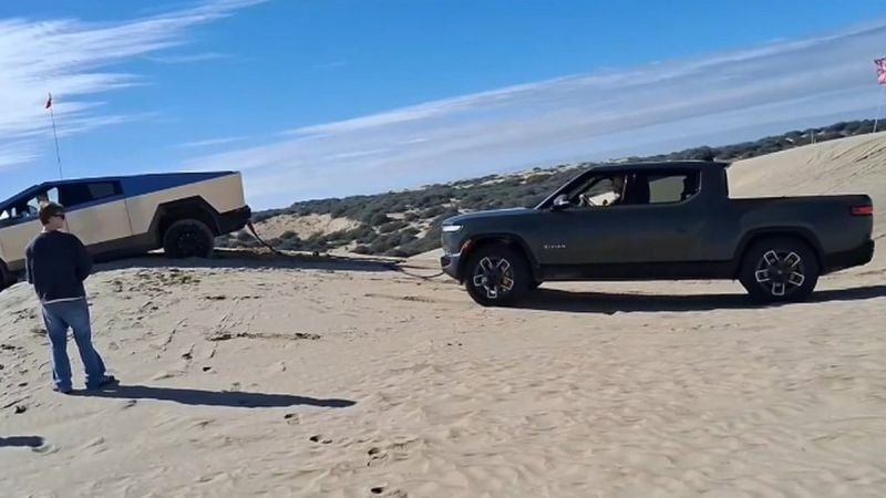 Rivian R1t Pulling Tesla Cybertruck
