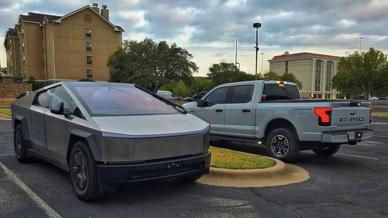 Tesla Cybertruck parked beside a Ford F-150 Lightning