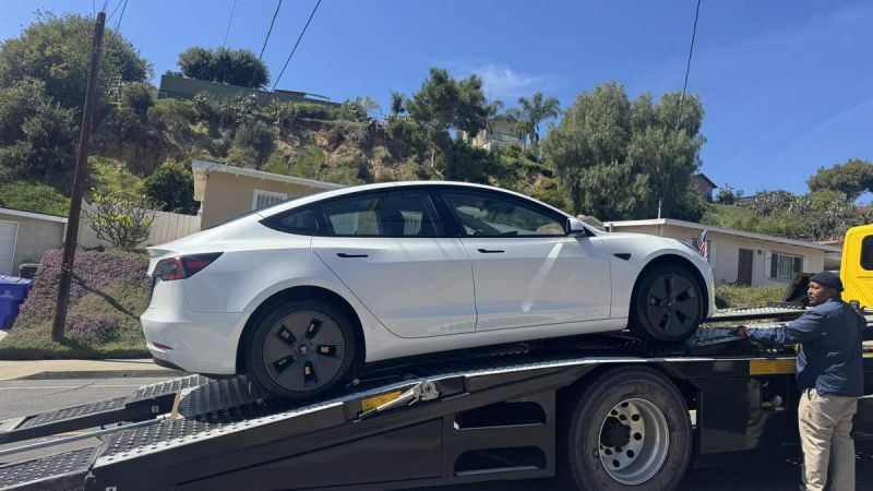 White Tesla Model 3 on Tow Truck