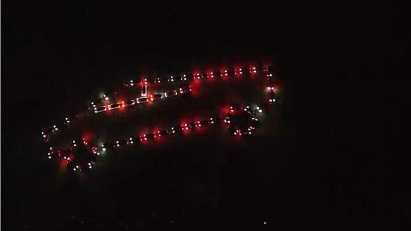 Tesla Owners Park In Shape of a Cybertruck and Perform Biggest Tesla Light Show
