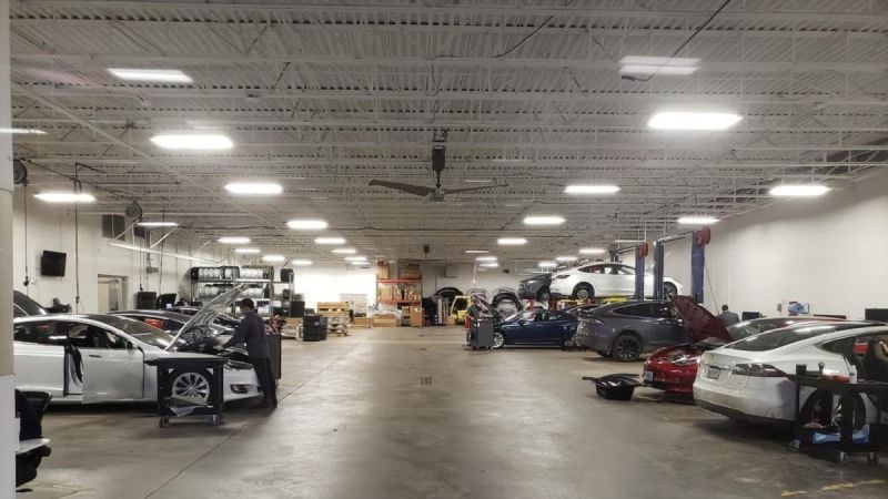 A busy Tesla service center repairs Tesla cars 