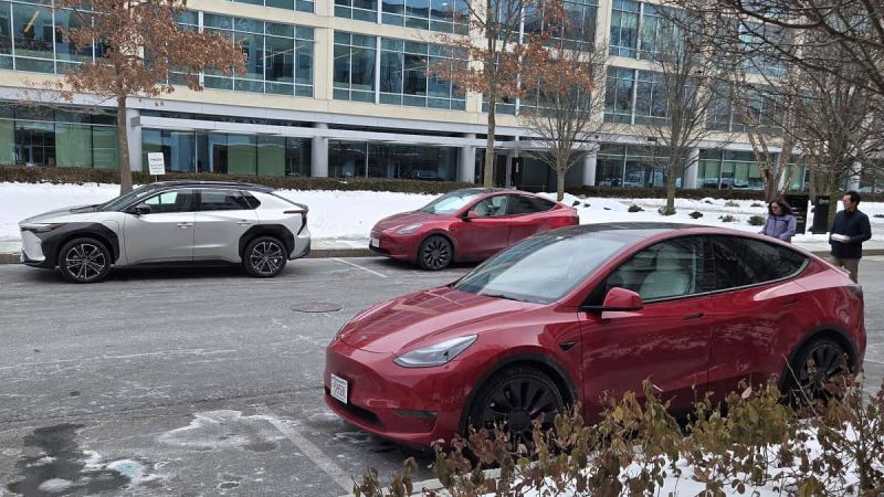 Picture of Toyota bZ4X parked near Tesla Model Ys by John Goreham