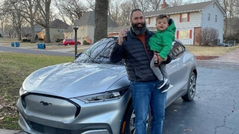 Ford engineer proudly displays keys of an EV he worked to design
