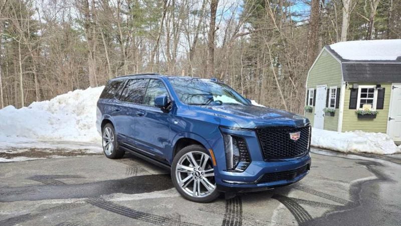 A 2026 Cadillac Escalade strikes a handsome pose in a wintery setting