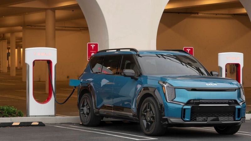 Image shows Kia EV9 at Tesla Supercharger