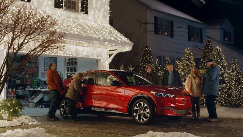 Christmas Vacation actors with Mustang Mach-E