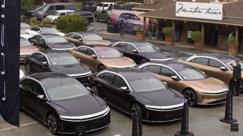 Image shows multiple Lucid Air sedans parked together at the end of the Lucid Rally.
