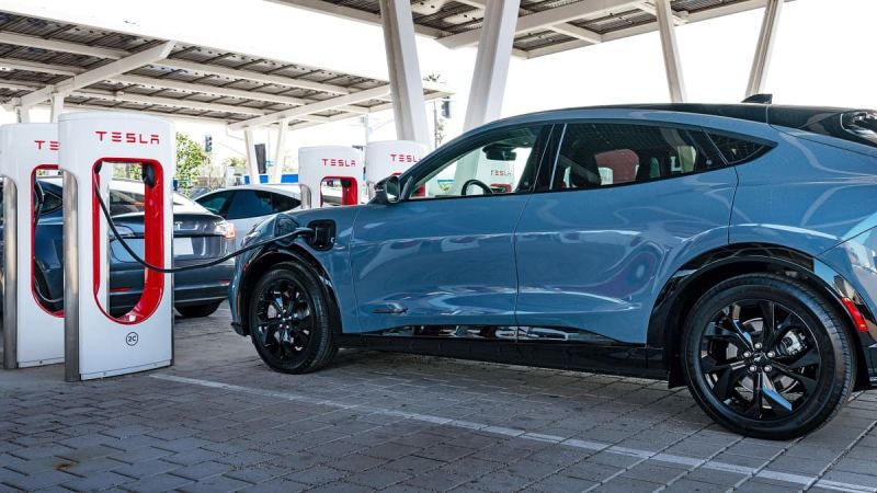 Image of 2024 Ford Mustang Mach-E charging at Tesla Supercharger