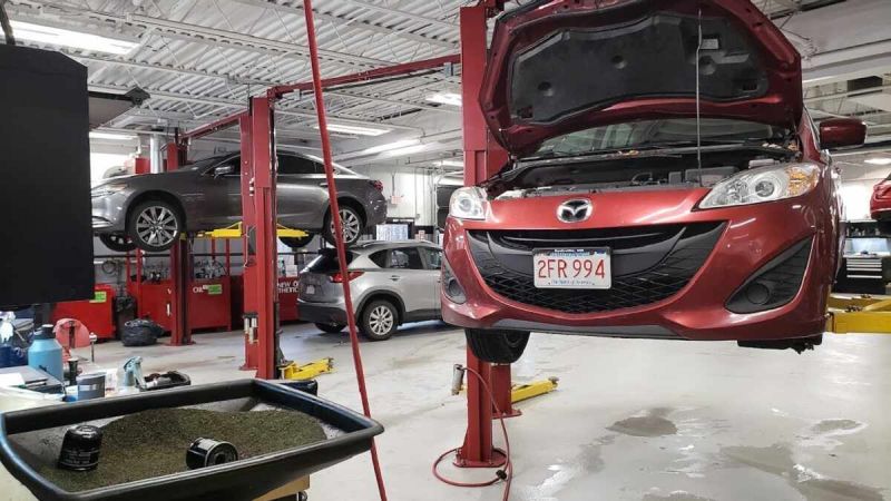 Image of Mazda vehicles being serviced by John Goreham