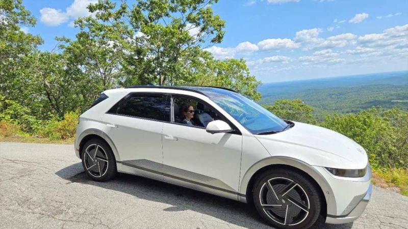 Image of Hyundai Ioniq 5 atop a mountain in fall