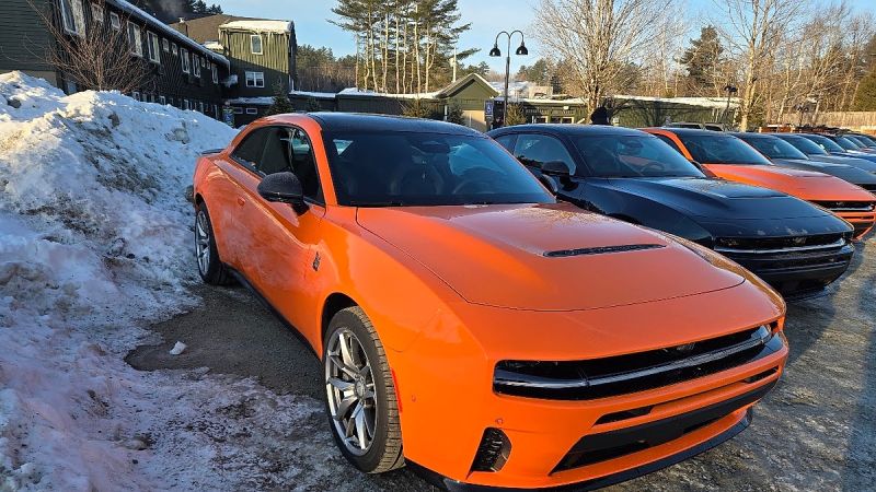 A row of 2026 Dodge Chargers is shown in a snowy setting