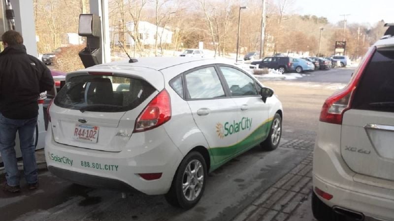 Image of Solar City vehicle at gas pump by John Goreham