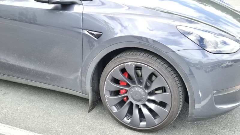 Tesla Model Y with curb rash all over its wheels from FSD hitting curb when parking