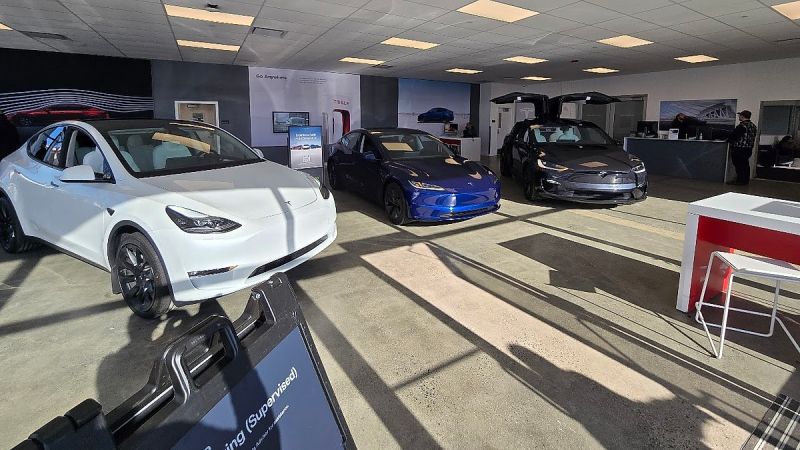 A Tesla dealership in Peabody Massachusetts has many cars on the showroom floor