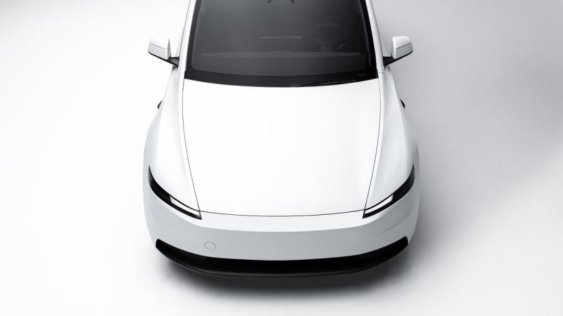 White Tesla Model Y electric SUV front view on a clean minimalist background