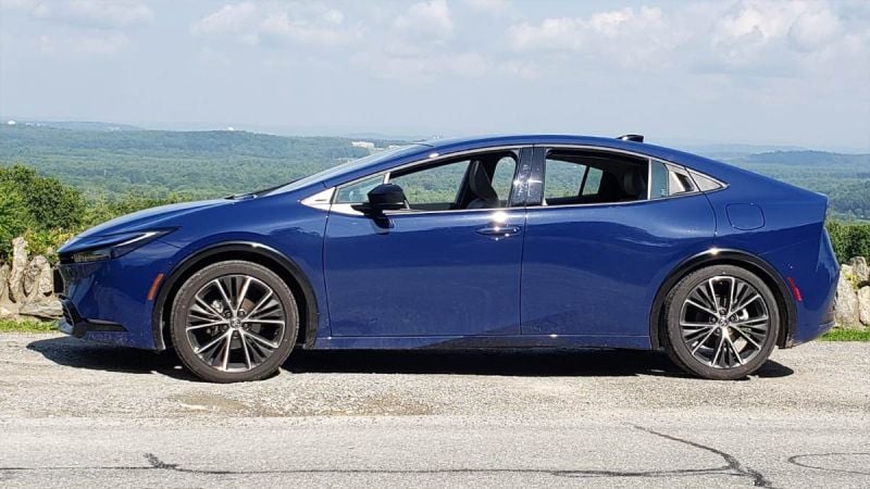 A Toyota Prius looks handsome in blue against a sky background