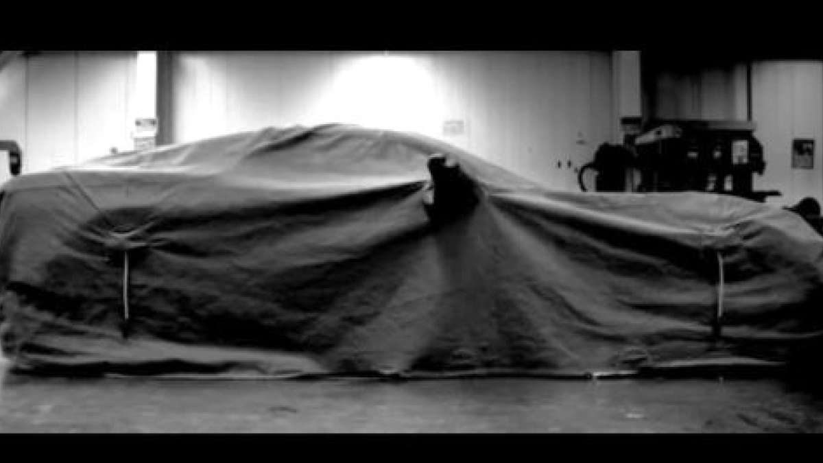 The 2014 Chevrolet Corvette under a cover