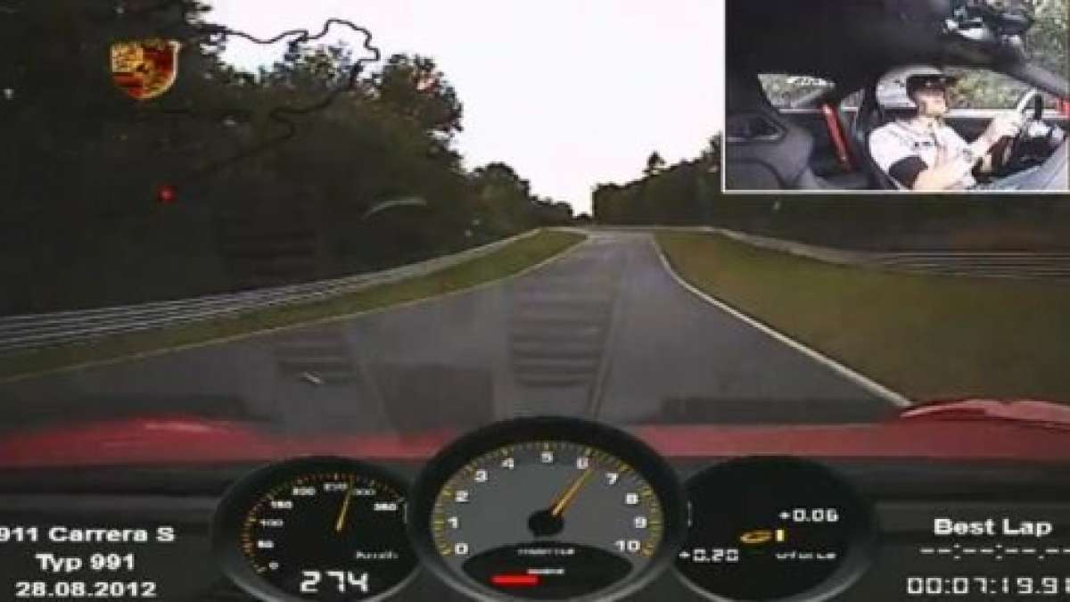 A freeze frame shot of the 2013 Porsche 911 Carrera S at the Ring.