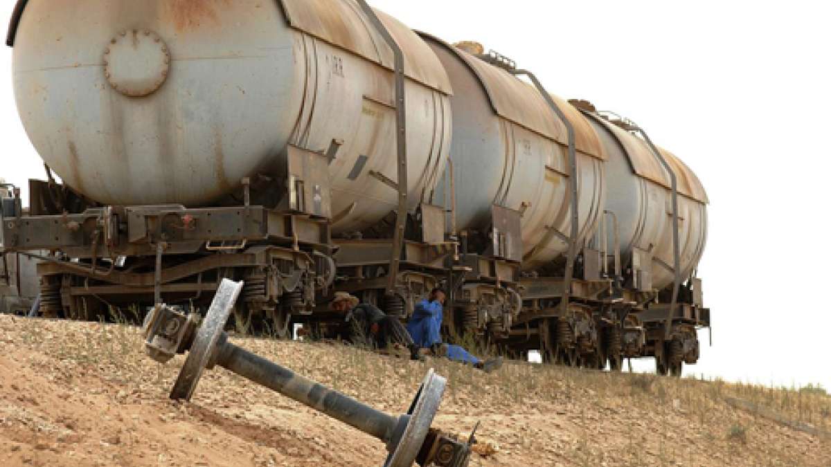 Derailed Iraqi rail cars, 2010. Wikimedia image is public domain. 