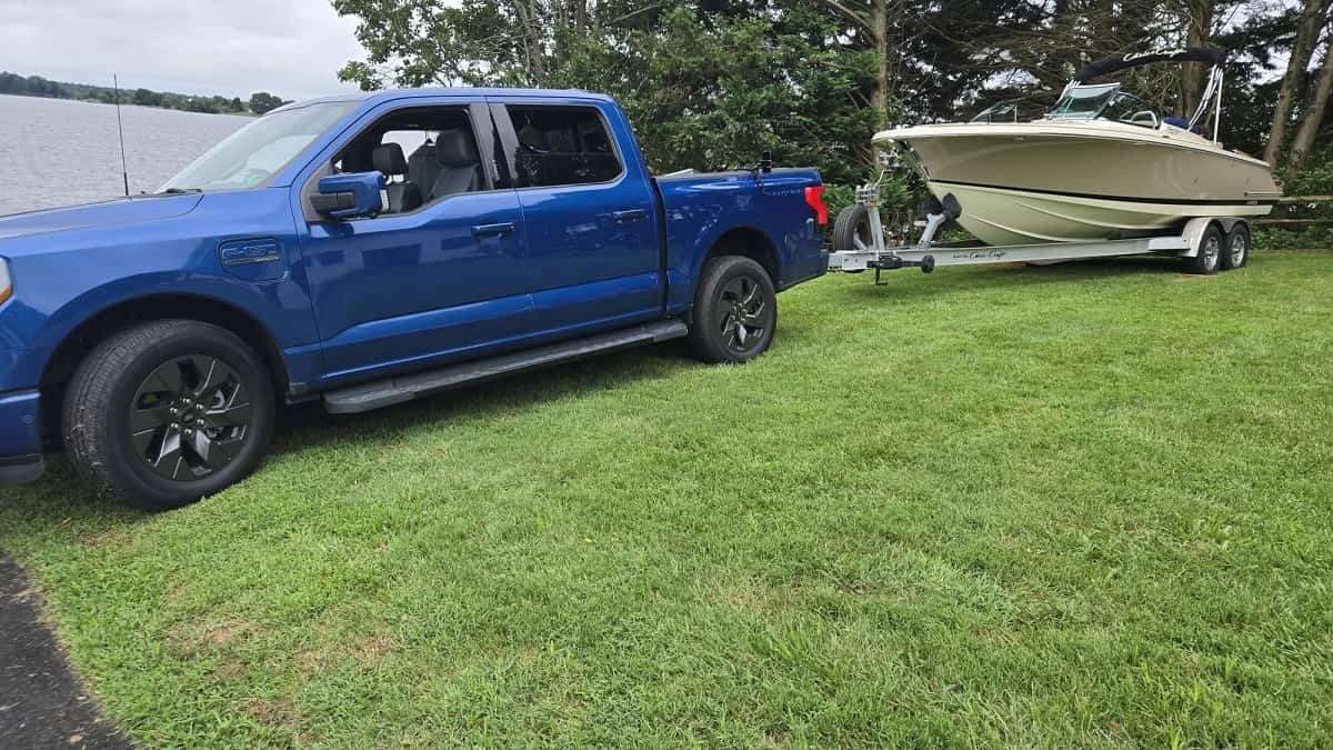 Ford F-150 Lightning towing a Chris Craft Launch 25 GTe electric boat