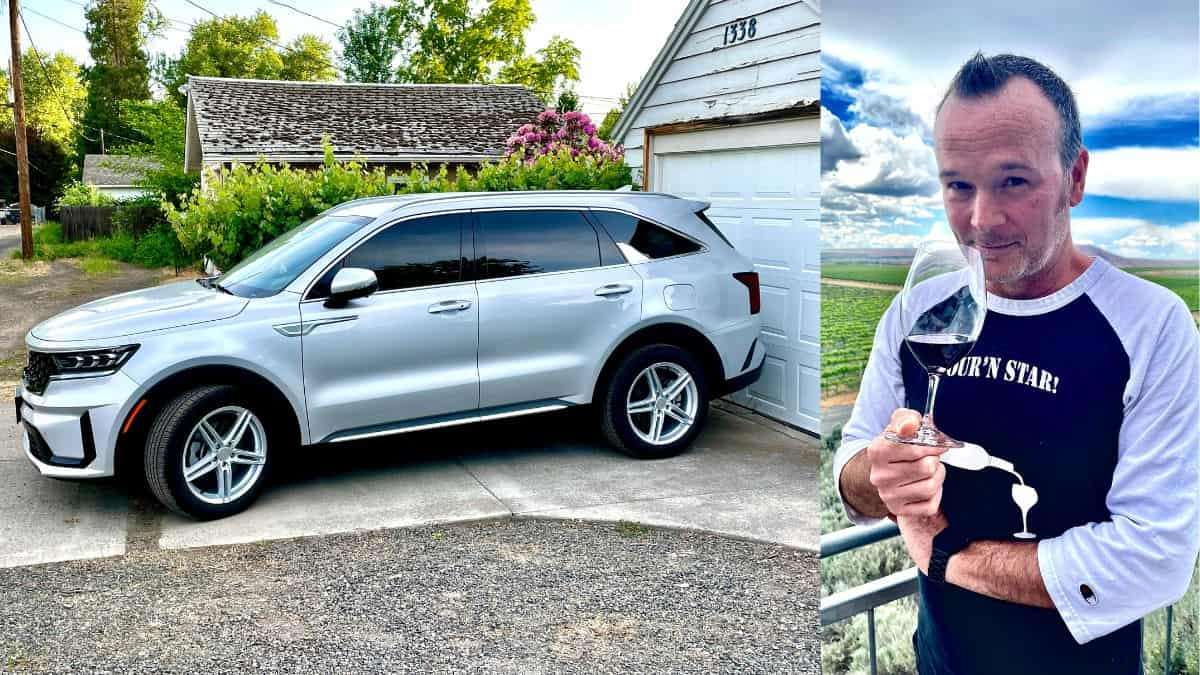 Silver Kia Sorento PHEV and author sipping wine at Kiona Vineyards