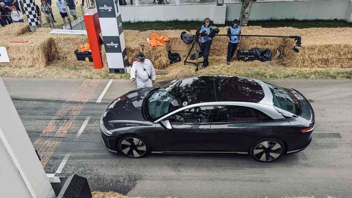 A dark grey Lucid Air Grand Touring Performance lines up at the start of the Goodwood Festival of Speed hill climb course.