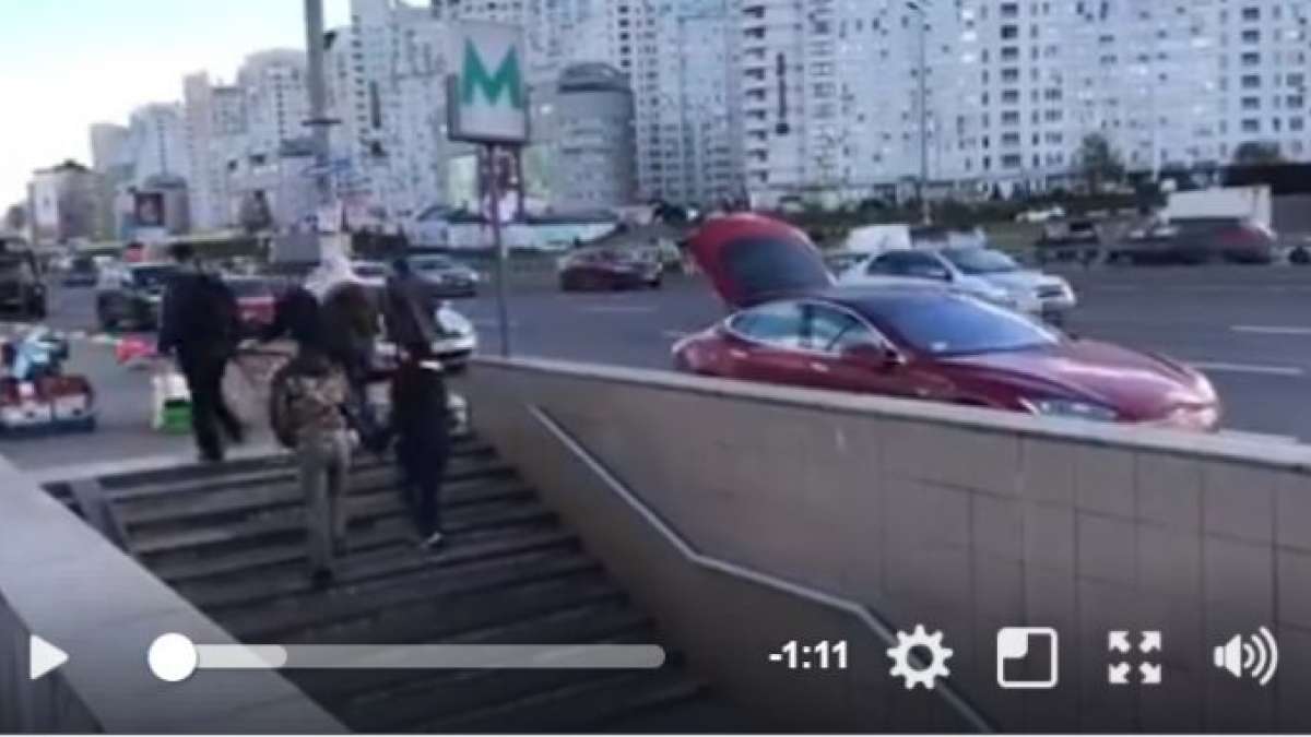 Man selling honey from Tesla Model S