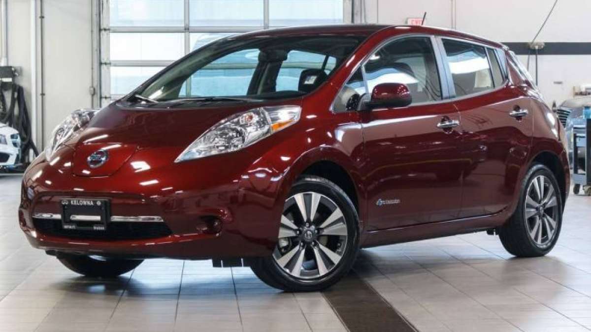 Red Nissan Leaf in a dealership 1200x90 size