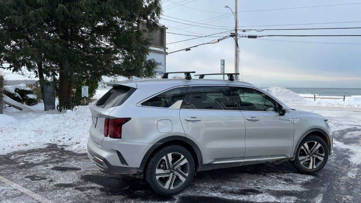 Silver Kia Sorento PHEV in front of snow bank
