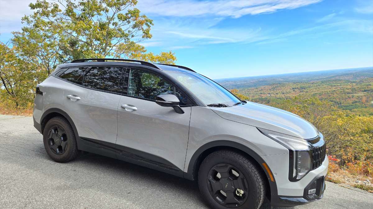 2026 Kia Sportage X-Pro Prestige captured on a mountain with fall vistas in the scene