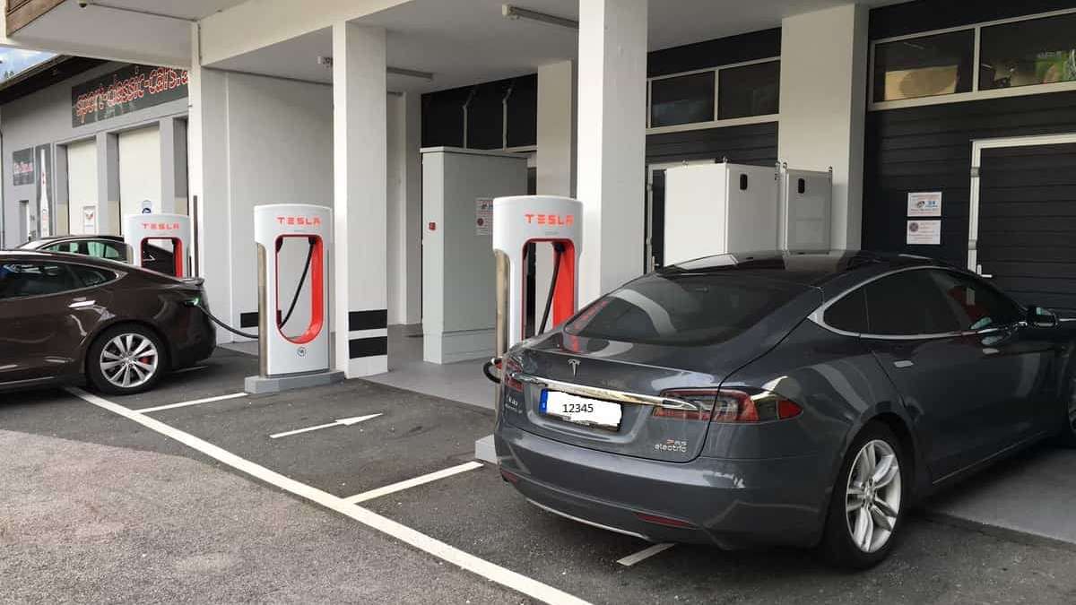 Tesla Model S cars charging at a supercharger