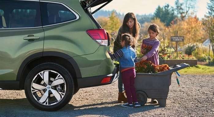 2020 Subaru Forester family members unloading from trunk
