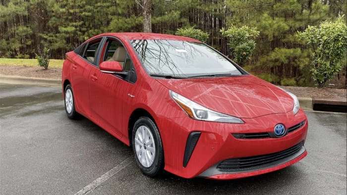 2021 Toyota Prius Supersonic Red profile view and front end