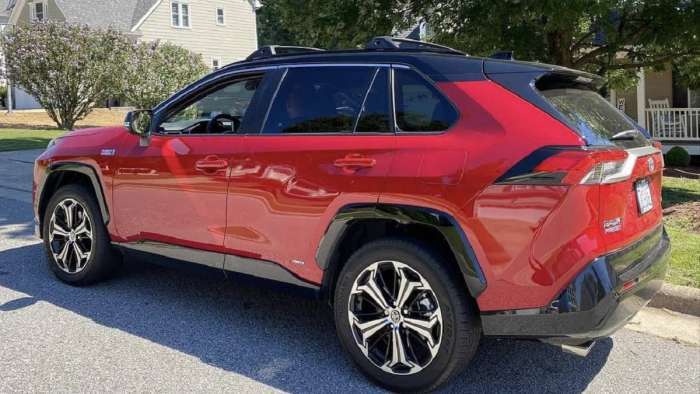 2021 Toyota RAV4 Prime XSE Supersonic Red profile view and back end