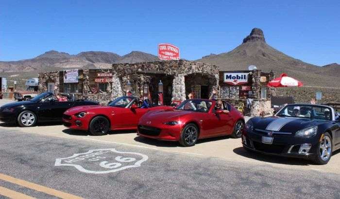 Mazda Miata and Fiat Spider Driving Historic US 66 to Cool Springs Service Station