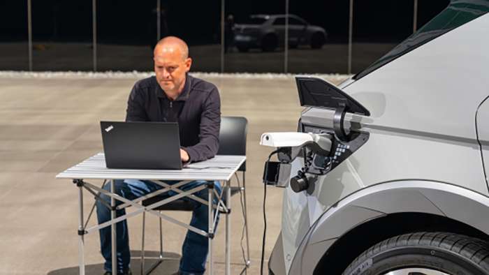 Hyundai Ioniq 5 charges a laptop
