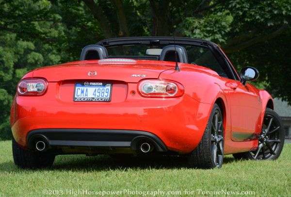 The rear end of the 2013 Mazda MX-5 Club with the top down