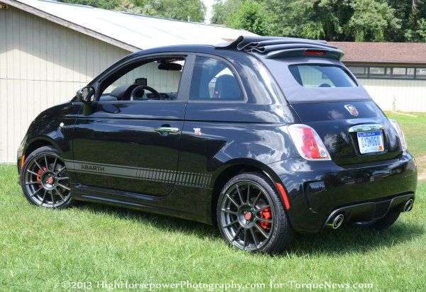 The side profile of the 2013 Fiat 500C Abarth with the top partially up